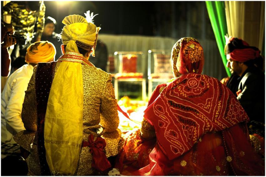 Colorful Indian bride and groom at a traditional w