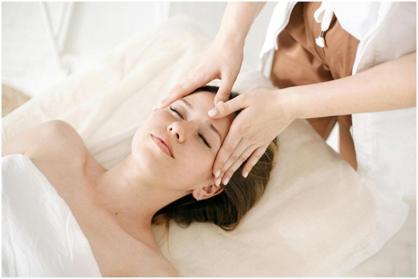 Woman receiving a therapeutic head massage at a sp