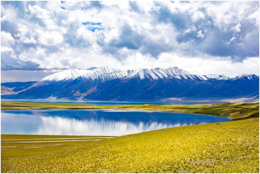 Stunning landscape of snow-capped mountains reflec