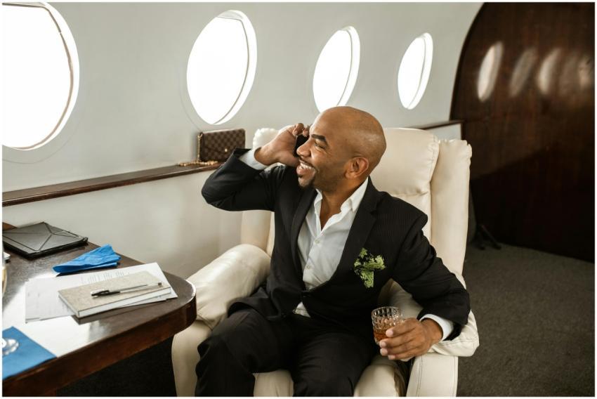 Executive man in a private jet making a call, repr