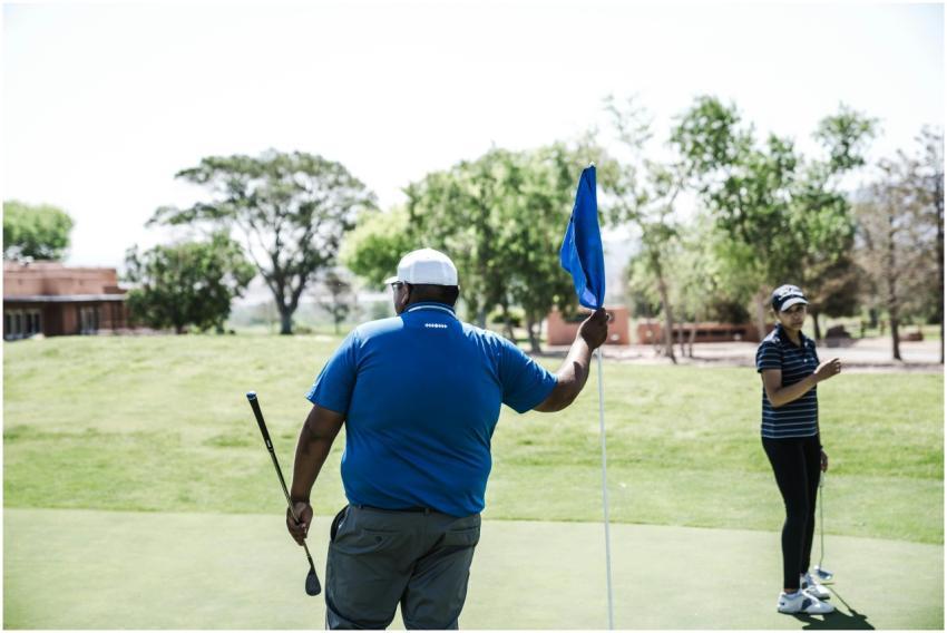 Two golfers enjoying a game on a sunny golf course