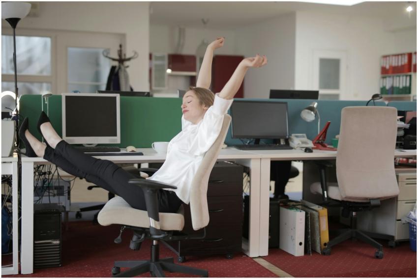 Side view of cheerful female employee in formal ou