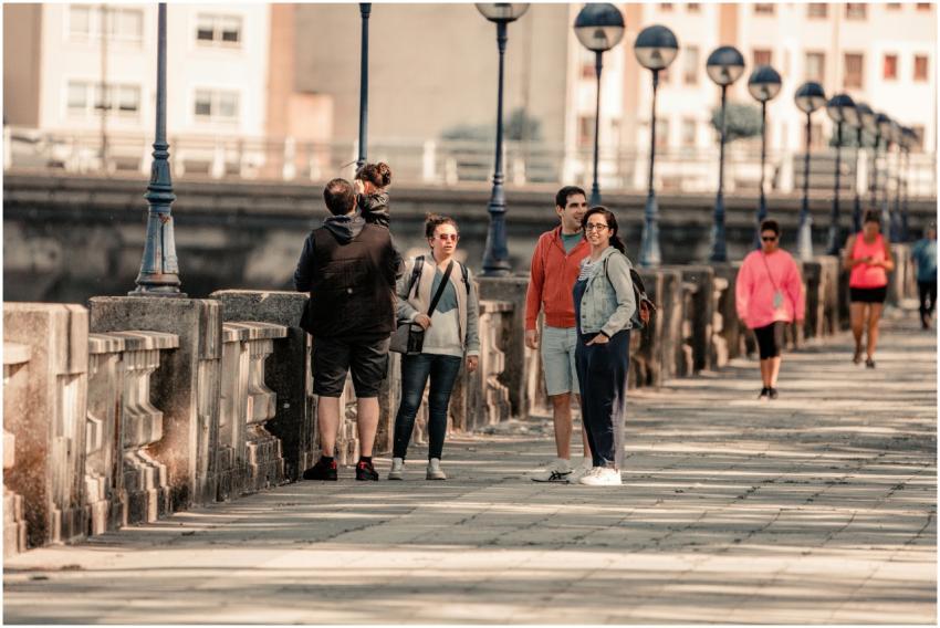 Group of people enjoying a sunny walk on a promena