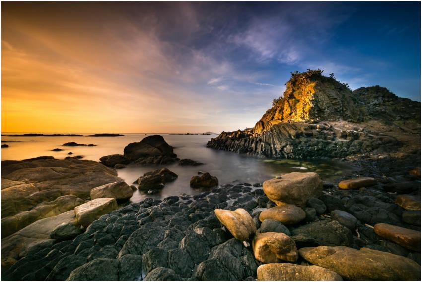 Dramatic seaside landscape with rocky shore, captu