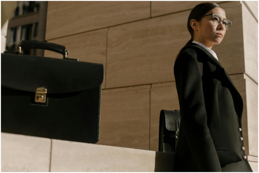 Confident businesswoman in professional attire sta