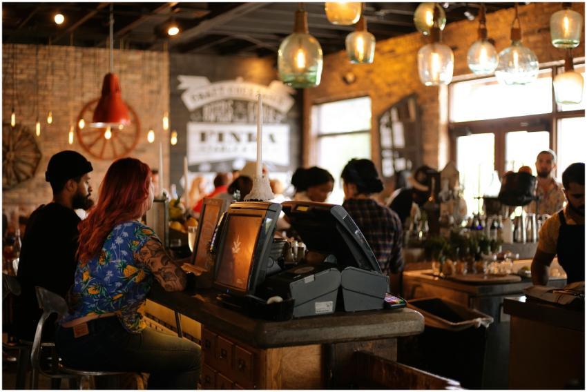 A bustling café in Miami with people enjoying a li