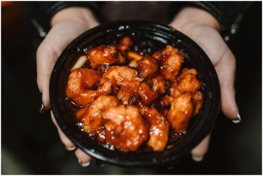 Close-up of a person holding a bowl of delicious A