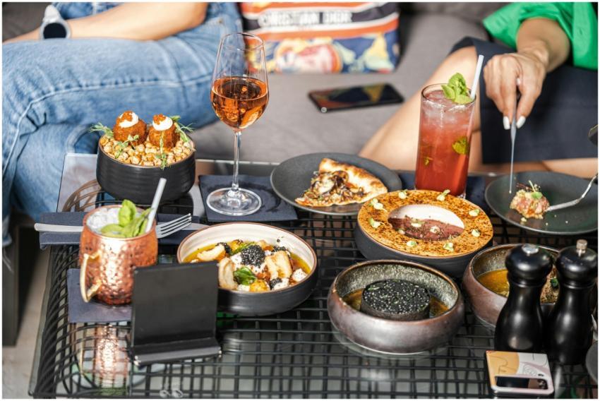 Gourmet dining experience with cocktails and a var