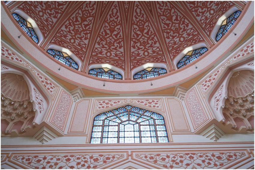 Beautiful intricate mosque interior with pink dome