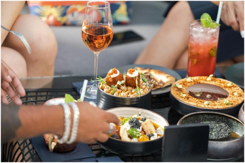 A vibrant table setting with gourmet dishes and dr