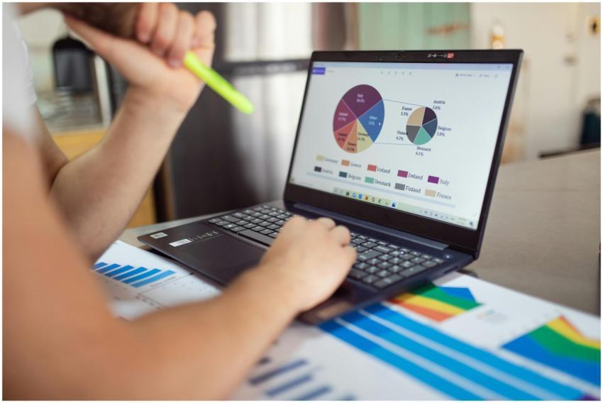Person analyzing financial charts and graphs on a