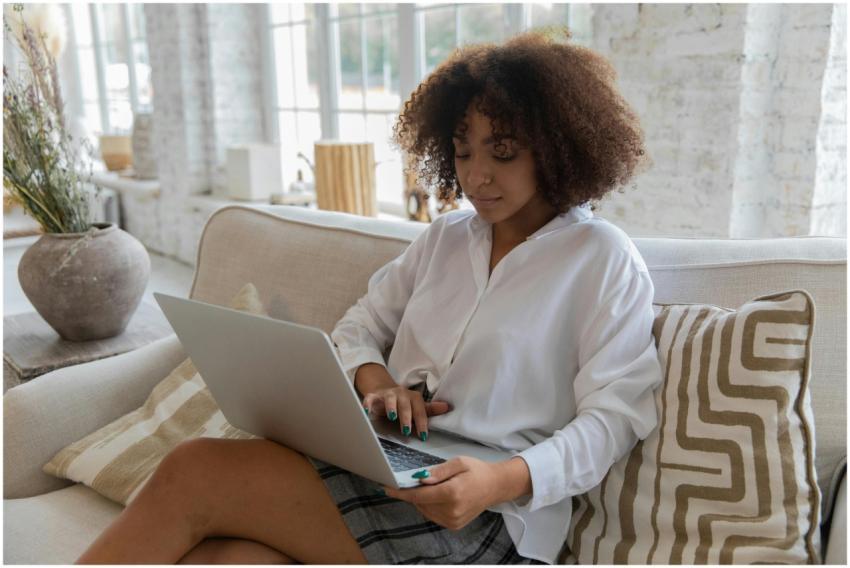 African American woman with curly hair focused on