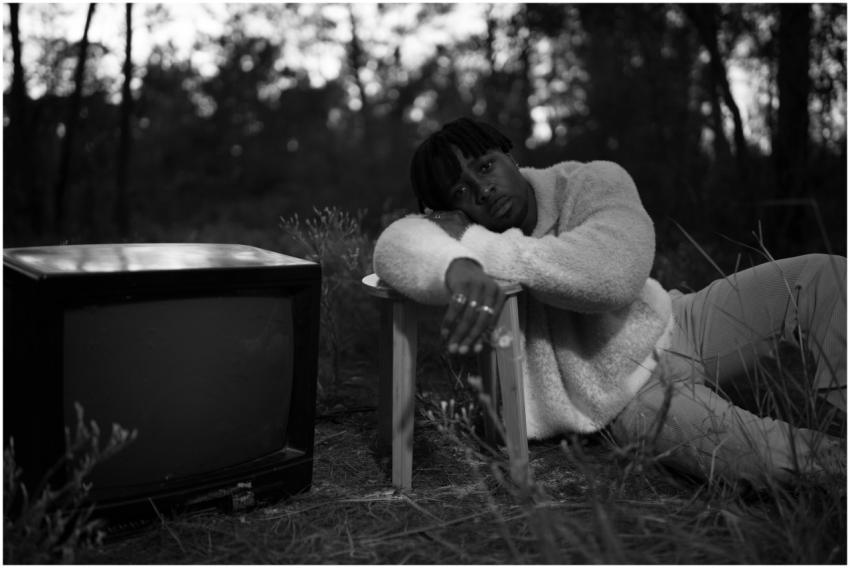 Contemplative Man Beside Vintage
