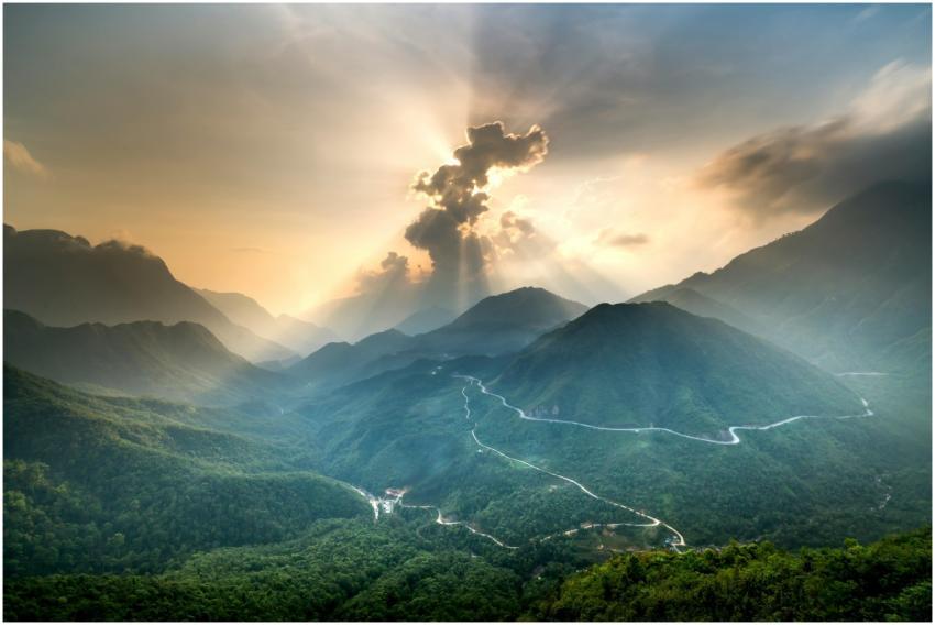 A stunning view of a sunlit mountain landscape sho