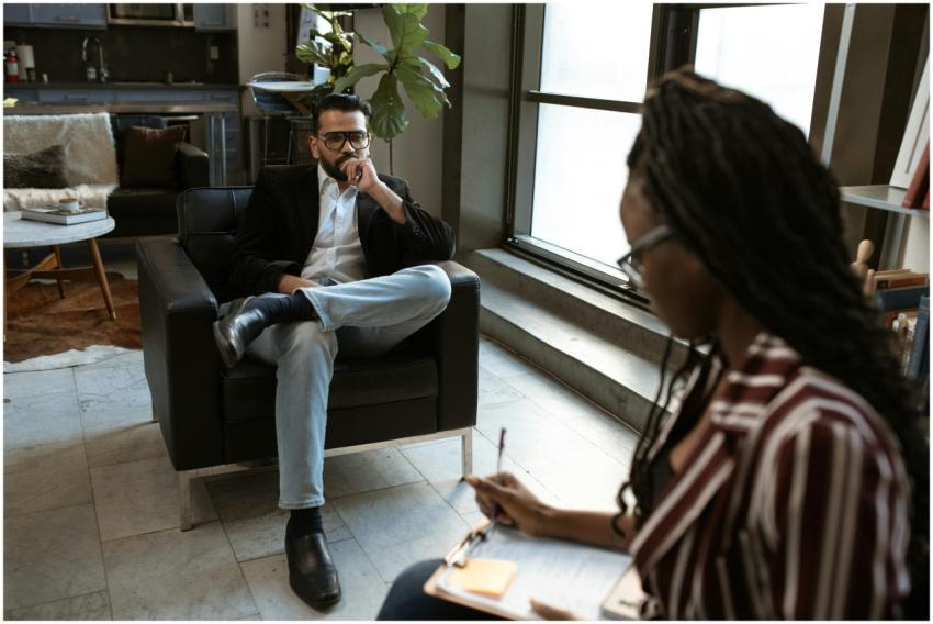 A man and woman engaged in an interview in a styli