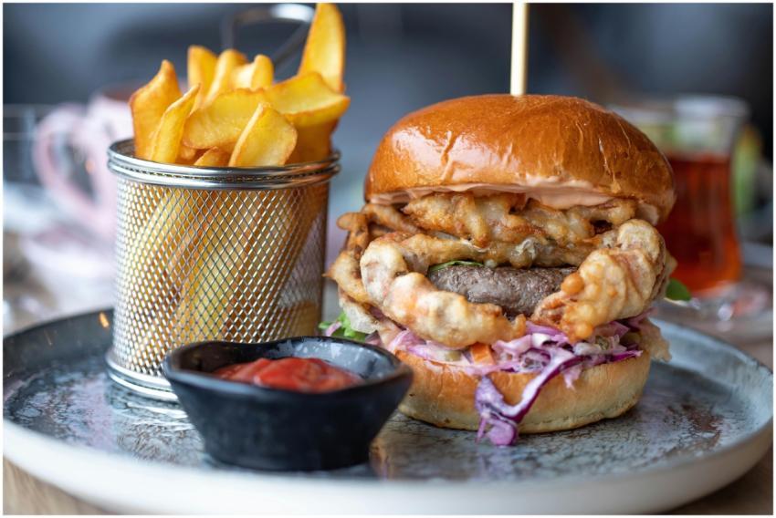 Delicious gourmet burger with crispy fries and ket