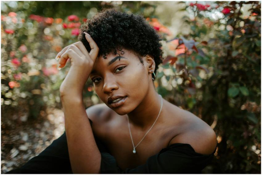 Close-up portrait of a woman surrounded by vibrant