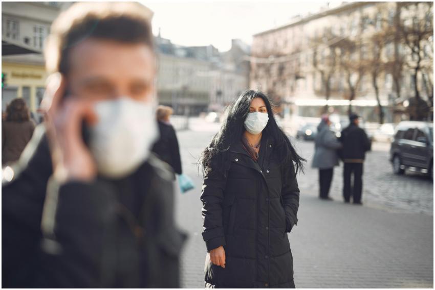 City street with people wearing face masks during