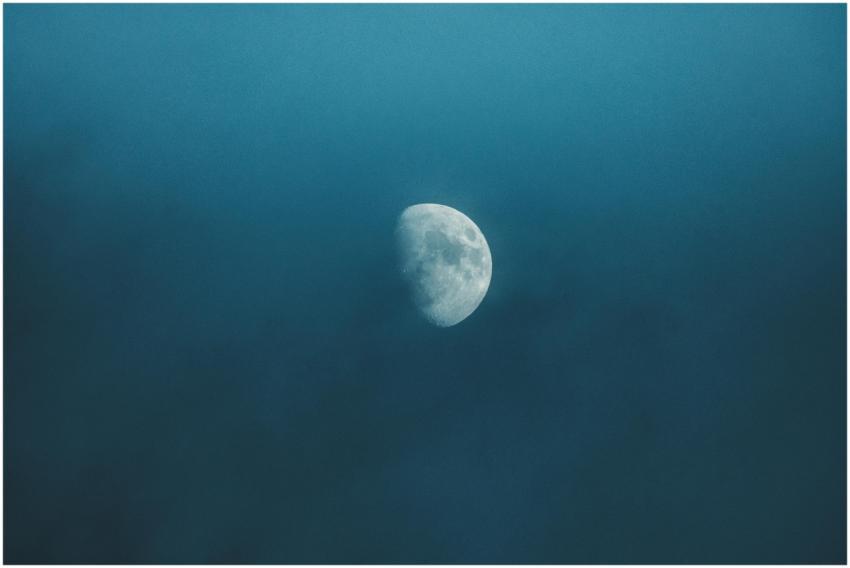 Waxing white moon with gray spots illuminating on