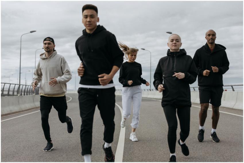 A diverse group of adults jogging together outdoor