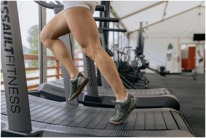 Close-up of a woman's legs running on a treadmill