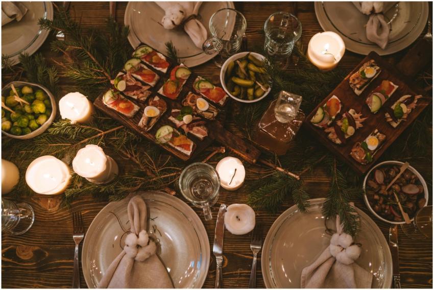 Cozy holiday dinner table with festive decor, cand