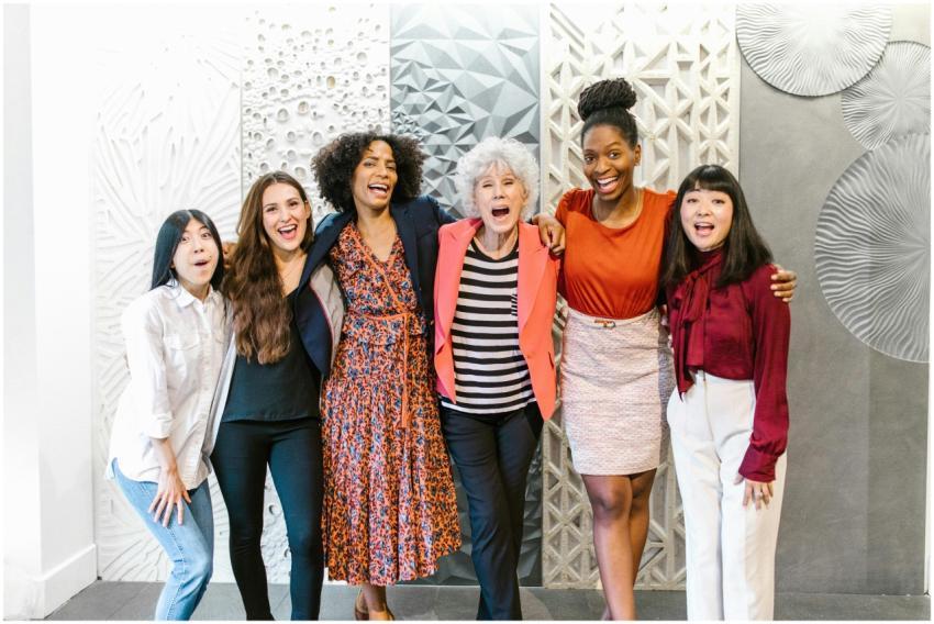 Group of diverse women happily posing together in