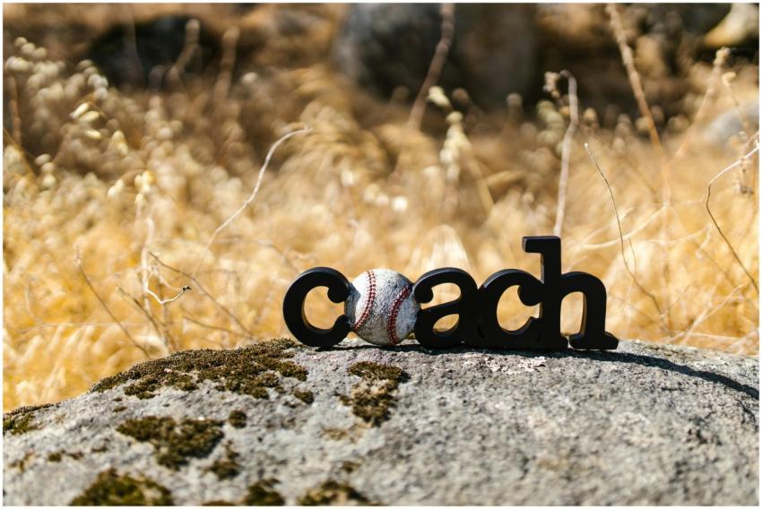 Creative display of a baseball with the word 'coac