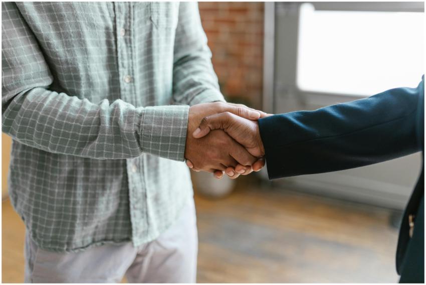 Close-up of two business professionals shaking han