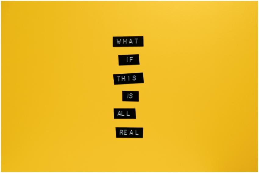 Inspirational text 'What if this is all real' on y