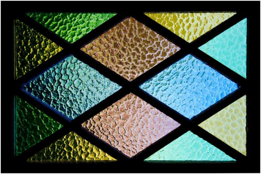 Vibrant stained glass featuring textured geometric