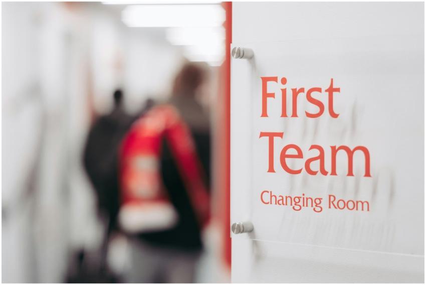 Blurry image of a sports team changing room sign w