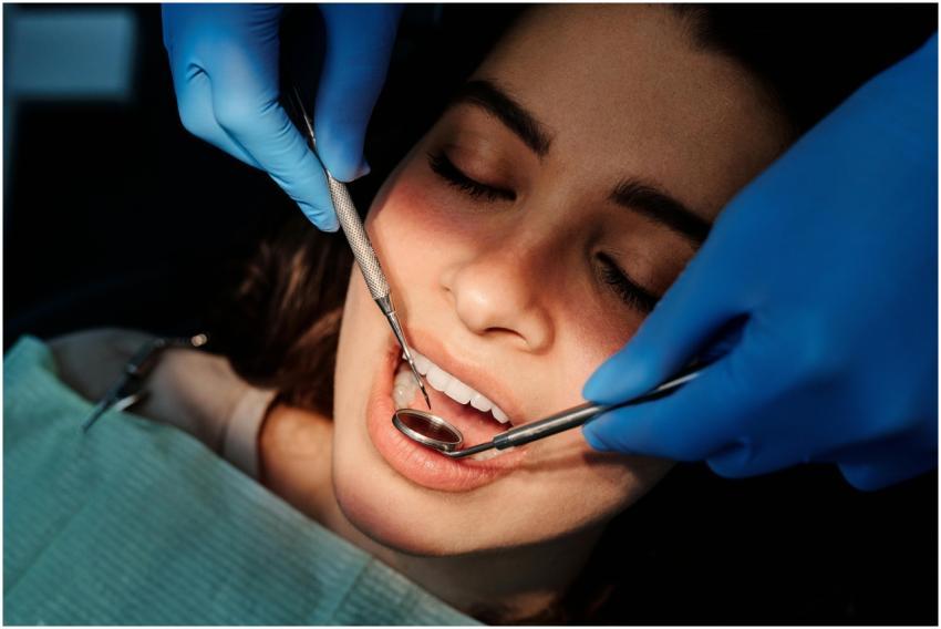 Close-up of a dental examination showing a woman p