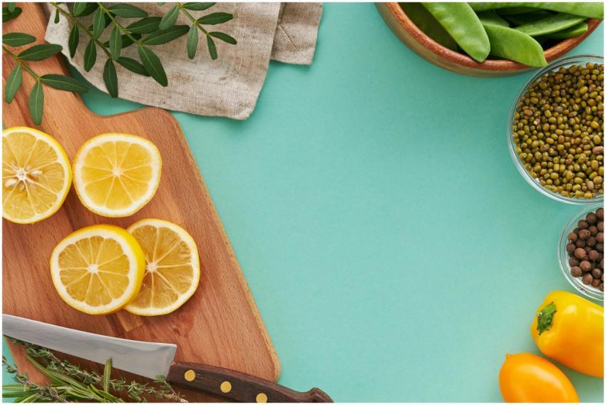 A bright flat lay of citrus fruits, vegetables, an