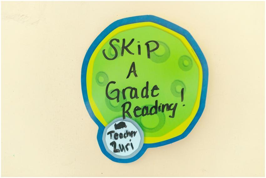 Colorful sign with 'Skip a Grade Reading' promotin