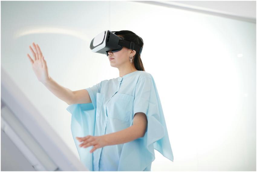 A woman wearing virtual reality goggles interactin