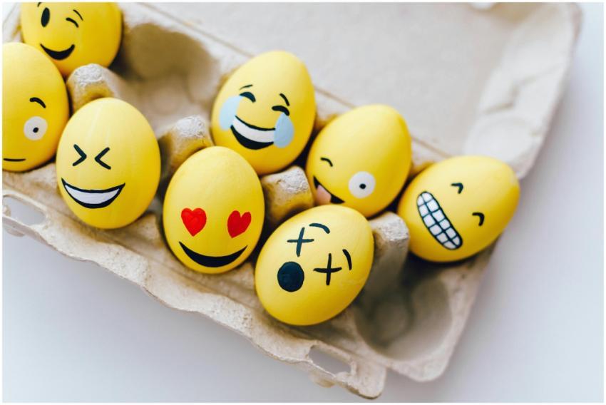 Bright yellow Easter eggs painted with fun emotico