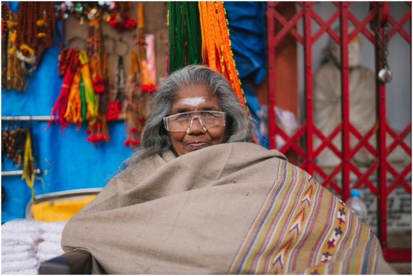 Candid portrait of a smiling elderly woman wrapped