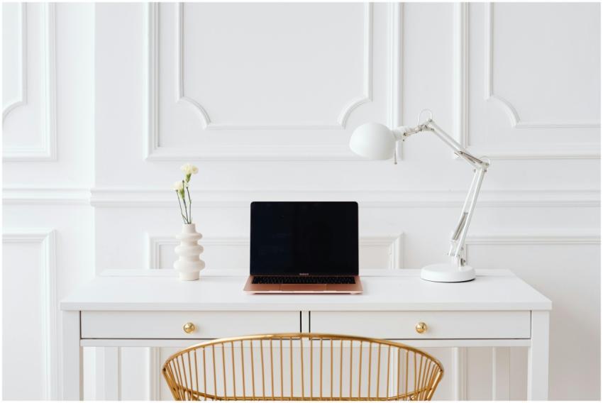 Elegant minimalist workspace with a laptop on a wh