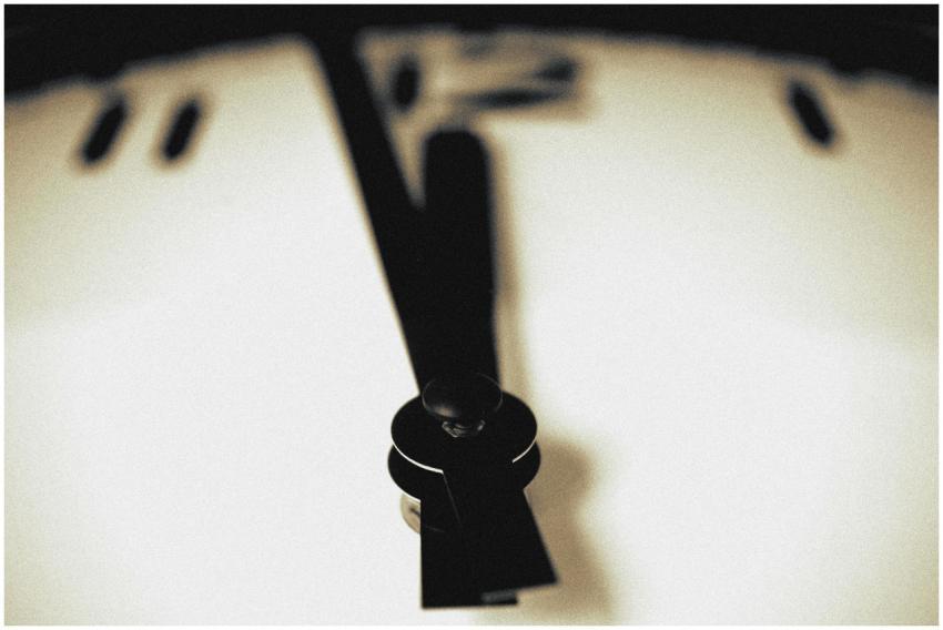 Artistic close-up of a blurred clock face emphasiz