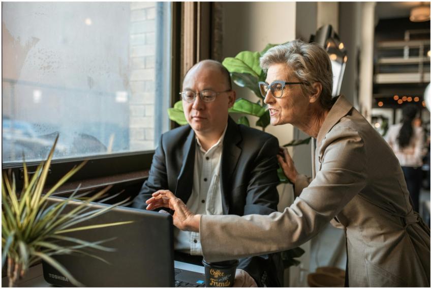 Senior professionals discussing a project at a mod