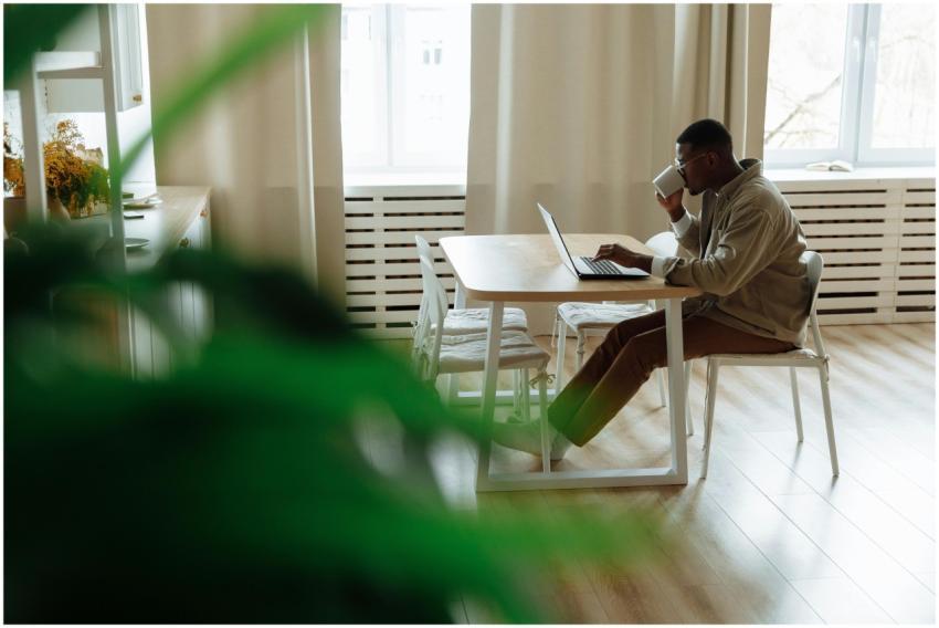 African American man working remotely from home us