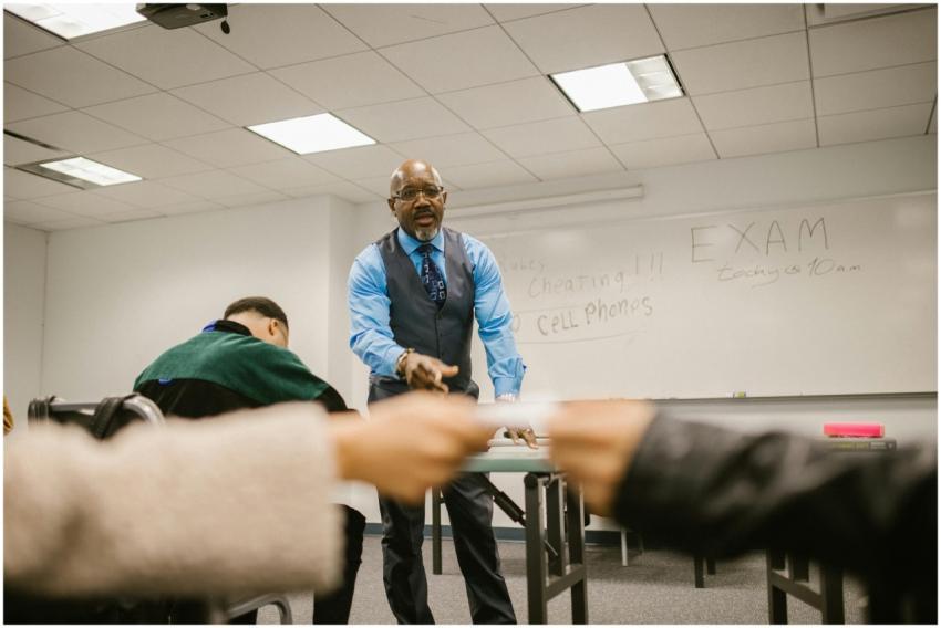 Students interacting with a teacher in a classroom