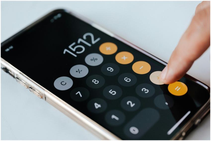 From above of crop faceless financier touching plu