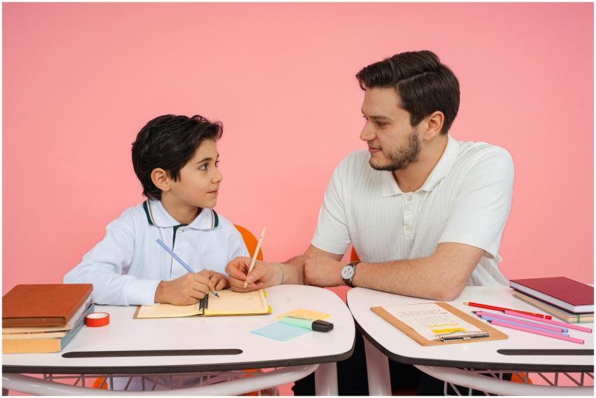 Father teaching his son at a desk with colorful st