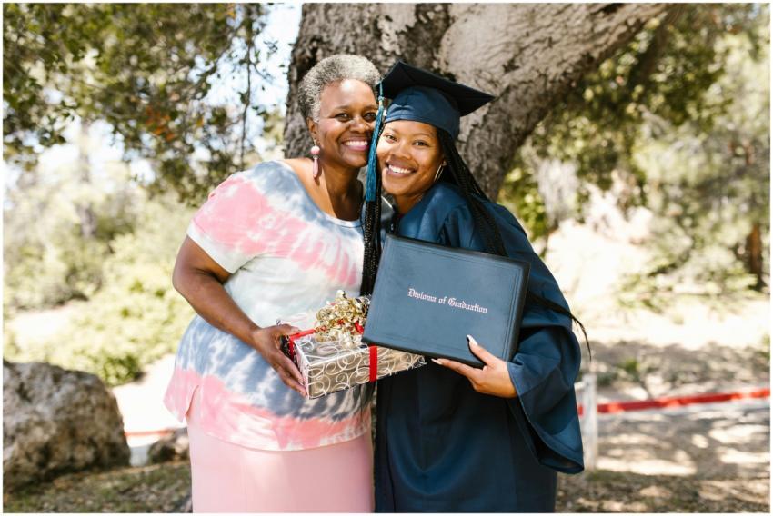 Graduating student with family member celebrating