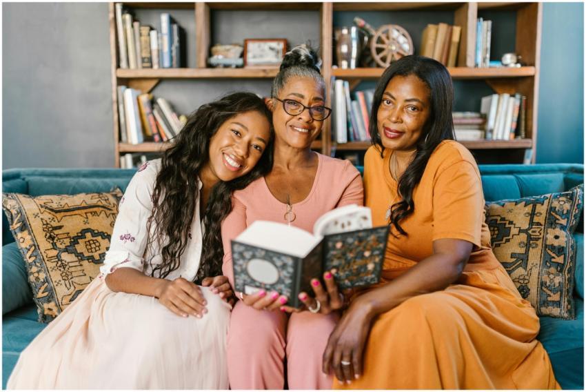 Three women enjoying a relaxed reading session ind