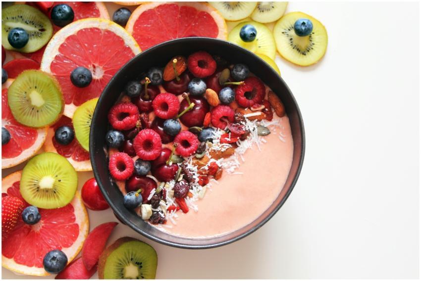 Colorful smoothie bowl with berries and tropical f