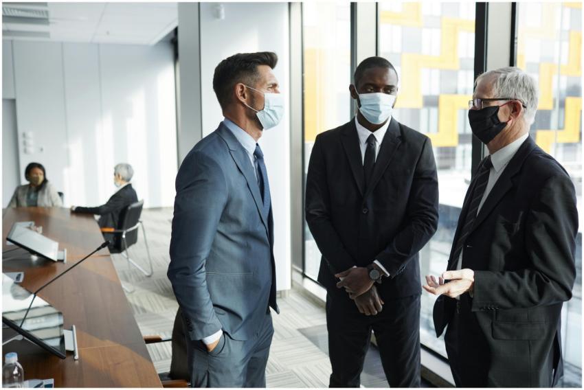 Businesspeople in formal attire having a discussio