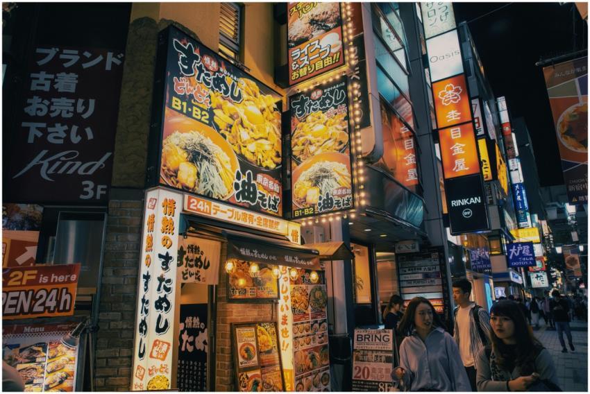 Bustling Tokyo street adorned with bright neon sig